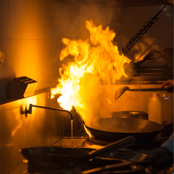 Hidden grease is what turns a flame into a fire Kitchen grease fire showing flames from cooking equipment